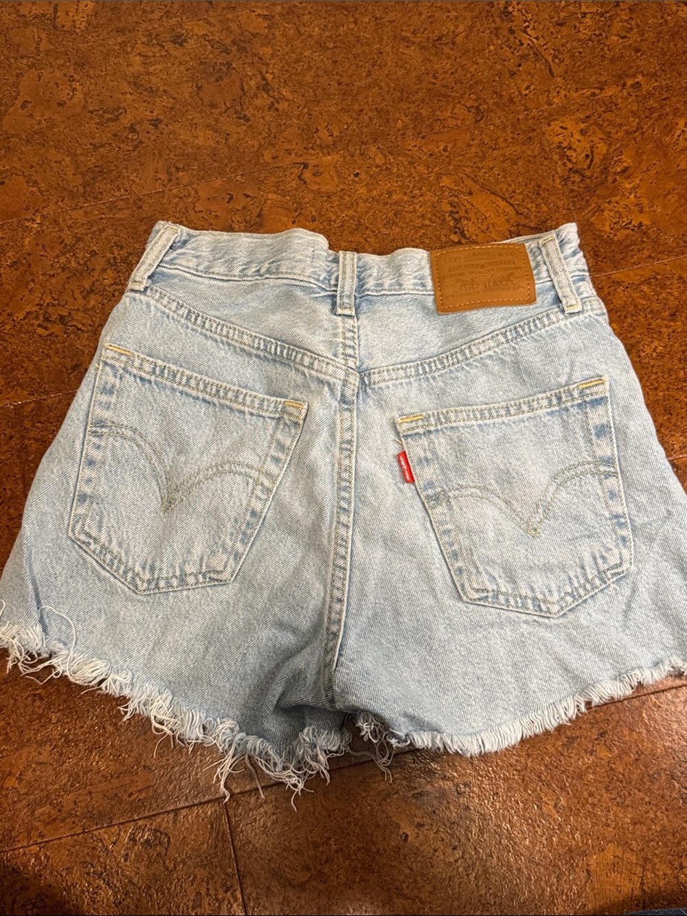 Levi's Light Blue Denim Ribcage Vintage Shorts with Frayed Hem